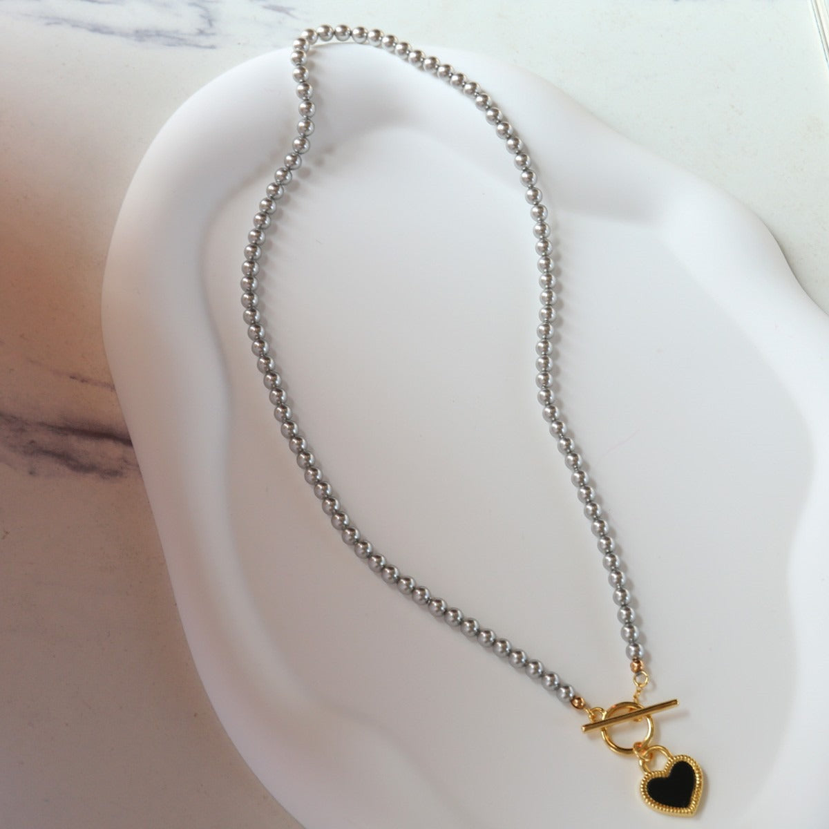 Two Hearts — Reversible Black & White Heart Necklace